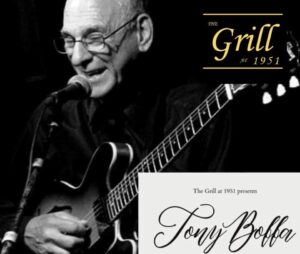 Tony Boffa performing with a guitar