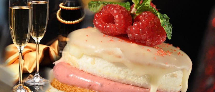 Raspberry-topped glazed dessert with champagne